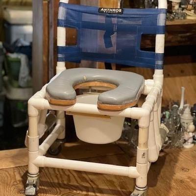 Anthros strong safe Shower chair commode with moveable arms for easy transfer and strong arm and wheel locks for safety