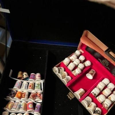 Assorted bone china thimbles about 40 or 50 of them  animals, flowers, special moifs