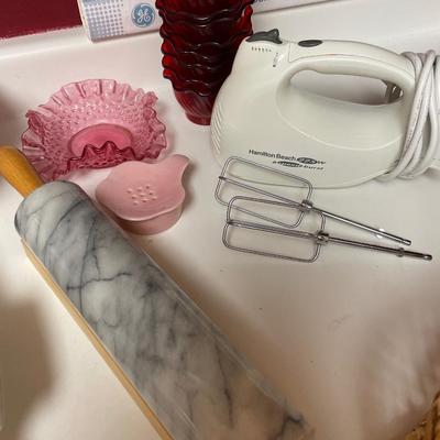 Marble rolling pin, hand beater and red dessert cupa