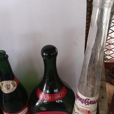 Vintage empty glass bottles with labels