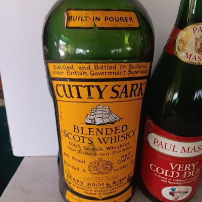 Vintage empty glass bottles with labels