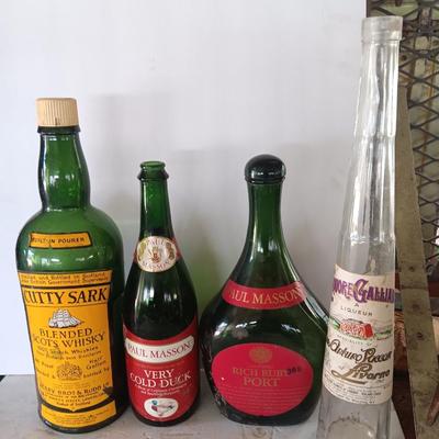 Vintage empty glass bottles with labels