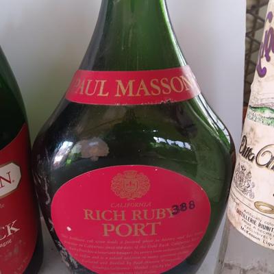 Vintage empty glass bottles with labels