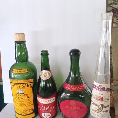 Vintage empty glass bottles with labels