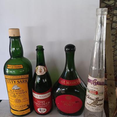 Vintage empty glass bottles with labels