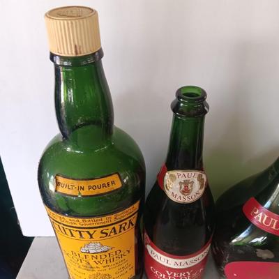 Vintage empty glass bottles with labels