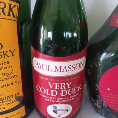 Vintage empty glass bottles with labels