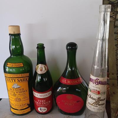 Vintage empty glass bottles with labels