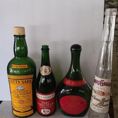 Vintage empty glass bottles with labels