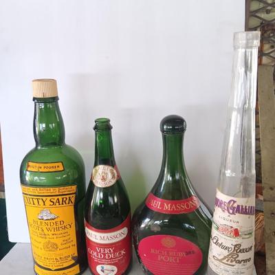 Vintage empty glass bottles with labels
