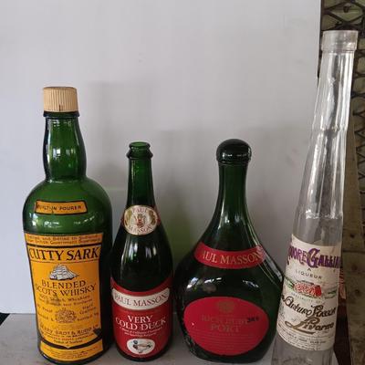 Vintage empty glass bottles with labels