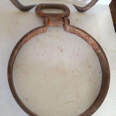old antique iron tongs, primitive vintage farm icehouse block and steel ring with a handle