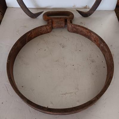 old antique iron tongs, primitive vintage farm icehouse block and steel ring with a handle