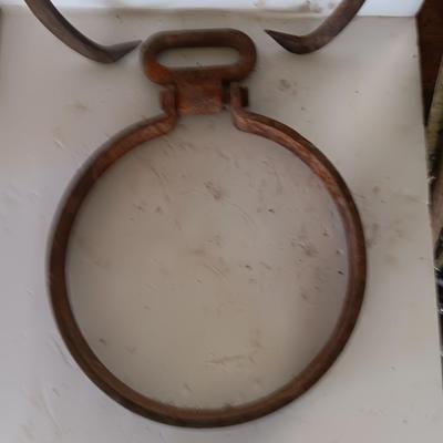old antique iron tongs, primitive vintage farm icehouse block and steel ring with a handle