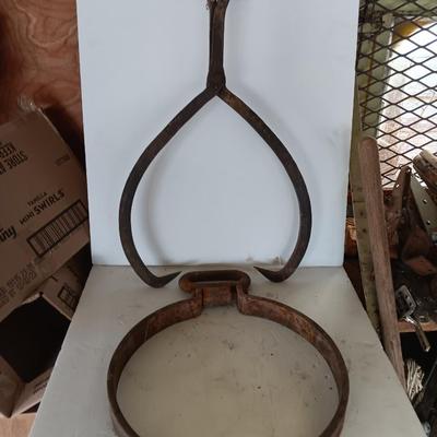 old antique iron tongs, primitive vintage farm icehouse block and steel ring with a handle