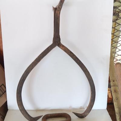 old antique iron tongs, primitive vintage farm icehouse block and steel ring with a handle