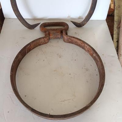 old antique iron tongs, primitive vintage farm icehouse block and steel ring with a handle