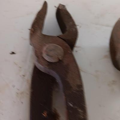 Blacksmith Blacksmithing tools Pliers, nips and hammer.