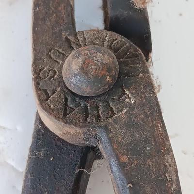 Blacksmith Blacksmithing tools Pliers, nips and hammer.