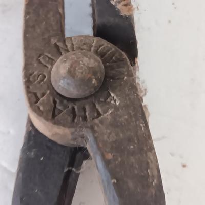 Blacksmith Blacksmithing tools Pliers, nips and hammer.