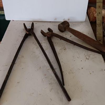 Blacksmith Blacksmithing tools Pliers, nips and hammer.