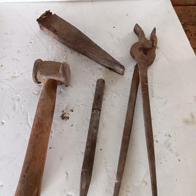 Blacksmith tools Blacksmithing pliers bars and hammer