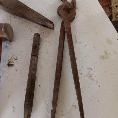 Blacksmith tools Blacksmithing pliers bars and hammer