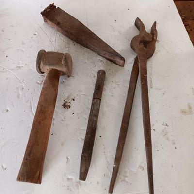 Blacksmith tools Blacksmithing pliers bars and hammer
