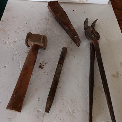 Blacksmith tools Blacksmithing pliers bars and hammer