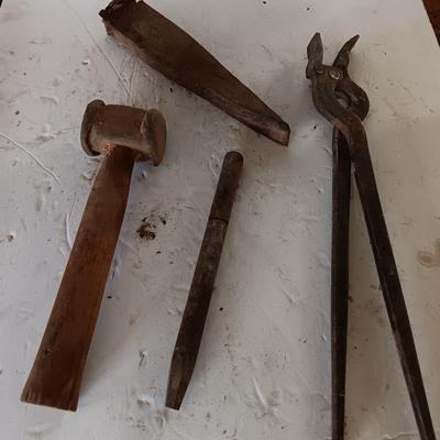 Blacksmith tools Blacksmithing pliers bars and hammer