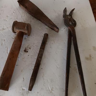 Blacksmith tools Blacksmithing pliers bars and hammer