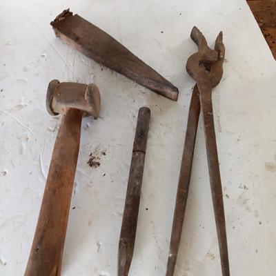 Blacksmith tools Blacksmithing pliers bars and hammer