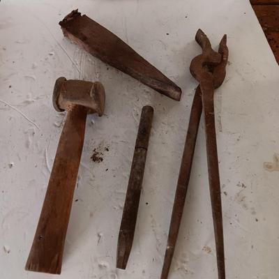 Blacksmith tools Blacksmithing pliers bars and hammer