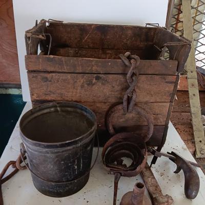 Antique wooden box with Antique farm items and tools