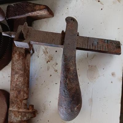 Antique wooden box with Antique farm items and tools