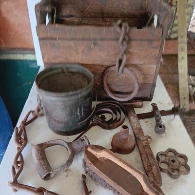 Antique wooden box with Antique farm items and tools