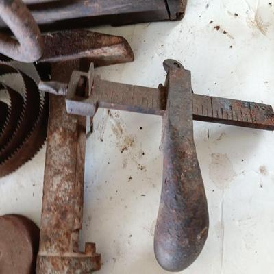 Antique wooden box with Antique farm items and tools