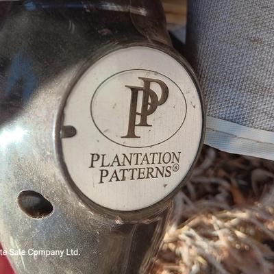 39" Round glass topped patio table with Plantation Pattern Umbrella.
