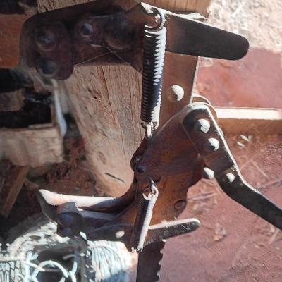 Fence stretcher tool with partial roll of barbed wire