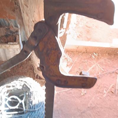 Fence stretcher tool with partial roll of barbed wire