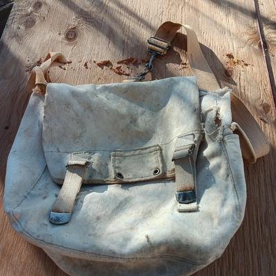 Vintage canvas fish bag with Vintage Fishing pole in canvas bag