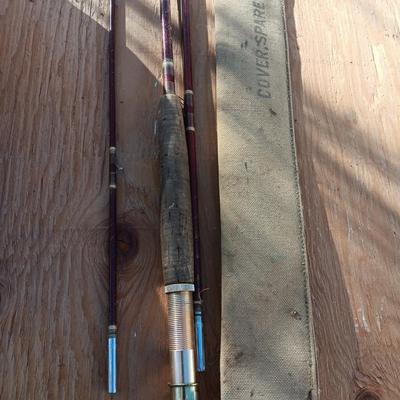 Vintage canvas fish bag with Vintage Fishing pole in canvas bag