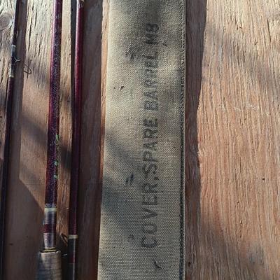 Vintage canvas fish bag with Vintage Fishing pole in canvas bag