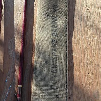 Vintage canvas fish bag with Vintage Fishing pole in canvas bag