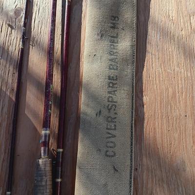 Vintage canvas fish bag with Vintage Fishing pole in canvas bag