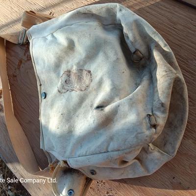 Vintage canvas fish bag with Vintage Fishing pole in canvas bag
