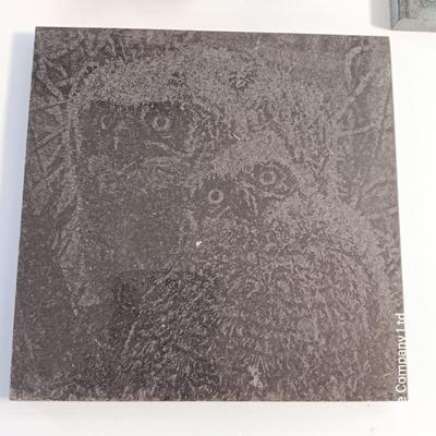 Two laser etched Owl Tiles with pocketknives.
