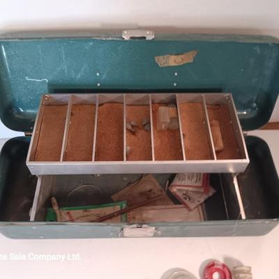Vintage metal tacklebox with cork lined storage and some tackle.