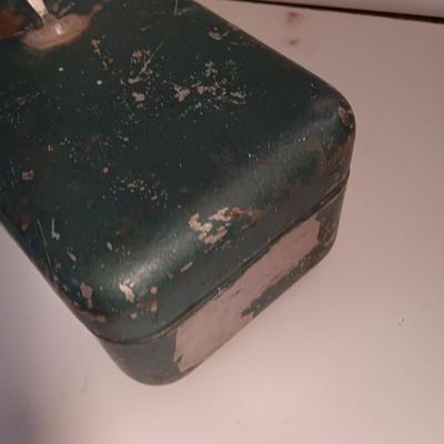 Vintage metal tacklebox with cork lined storage and some tackle.