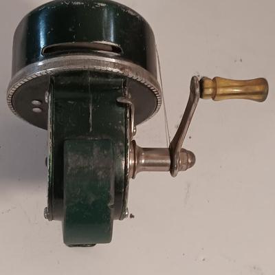 Two fishing reels Shakespeare push button Wondercast No. 1774 and green Fly fishing reel